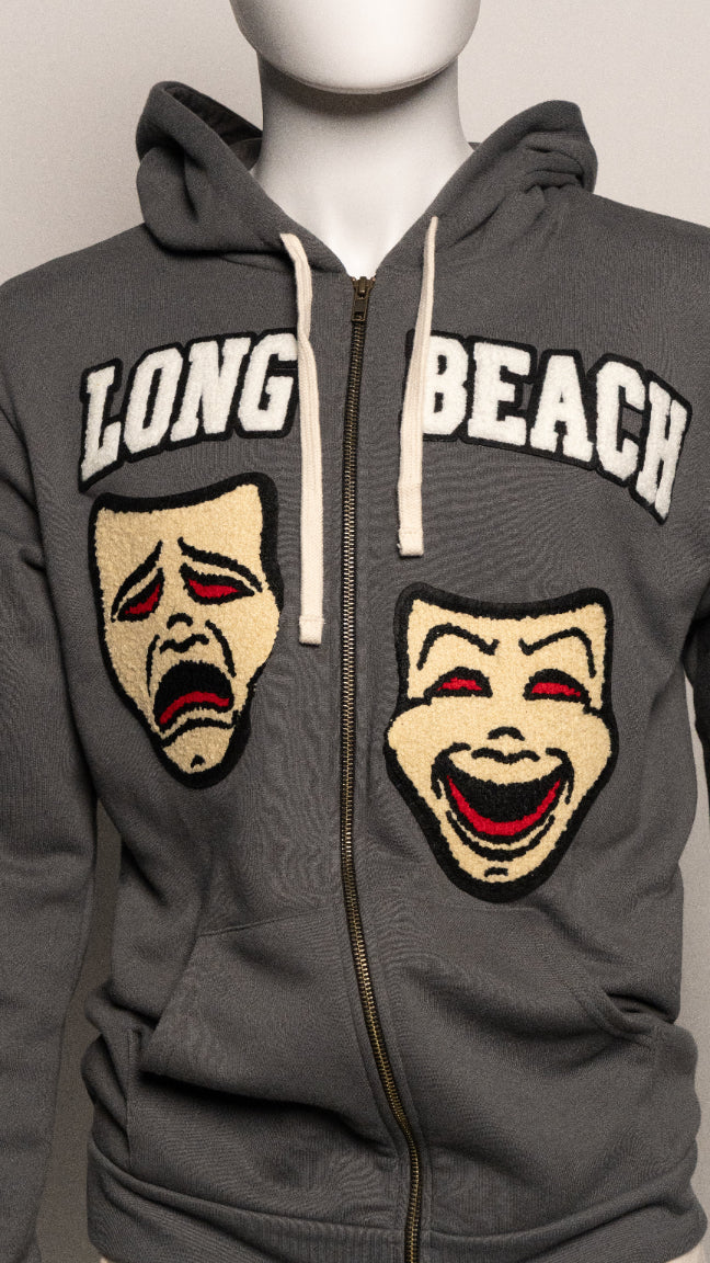 Gray hoodie with 'Long Beach' text and theatrical masks on a mannequin.