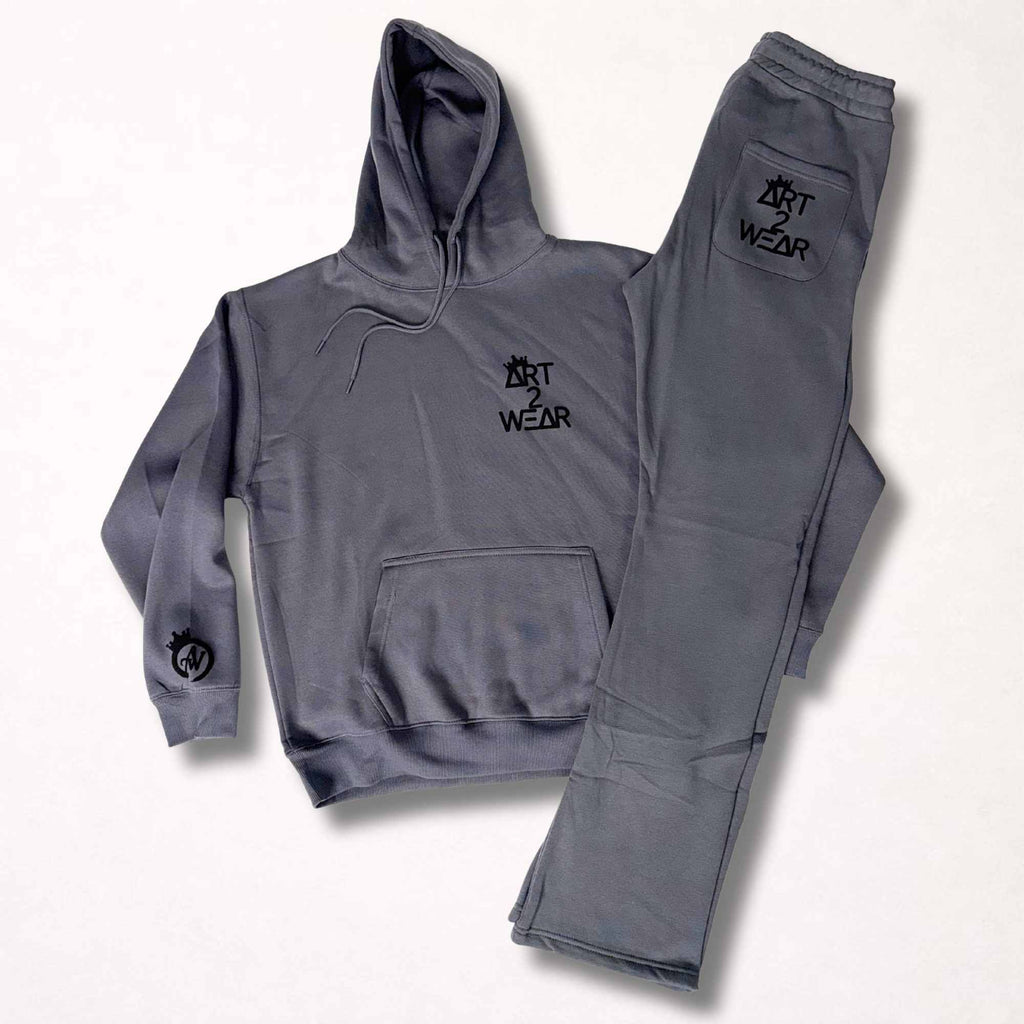 Dark gray sweatsuit set with black badge logo hoodie and matching sweatpants, Art to Wear streetwear set
