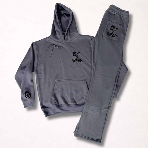 Dark gray sweatsuit set with black badge logo hoodie and matching sweatpants, Art to Wear streetwear set