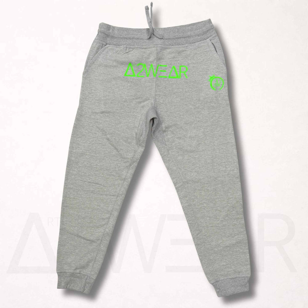 Gray sweatpants with green branding on a white background