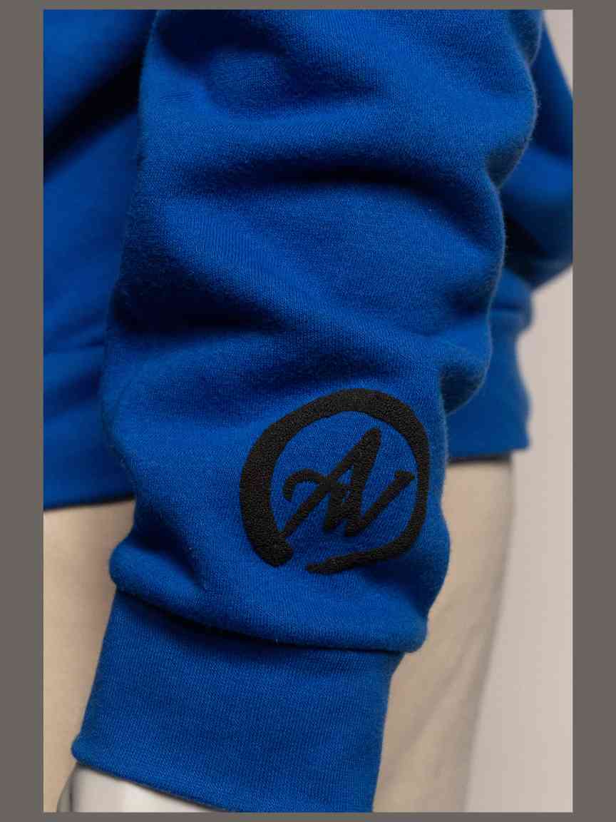 Blue sweatshirt with a black A2W logo on a neutral background