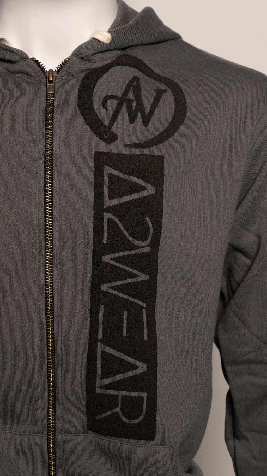 Gray hoodie with black logo and text on a neutral background