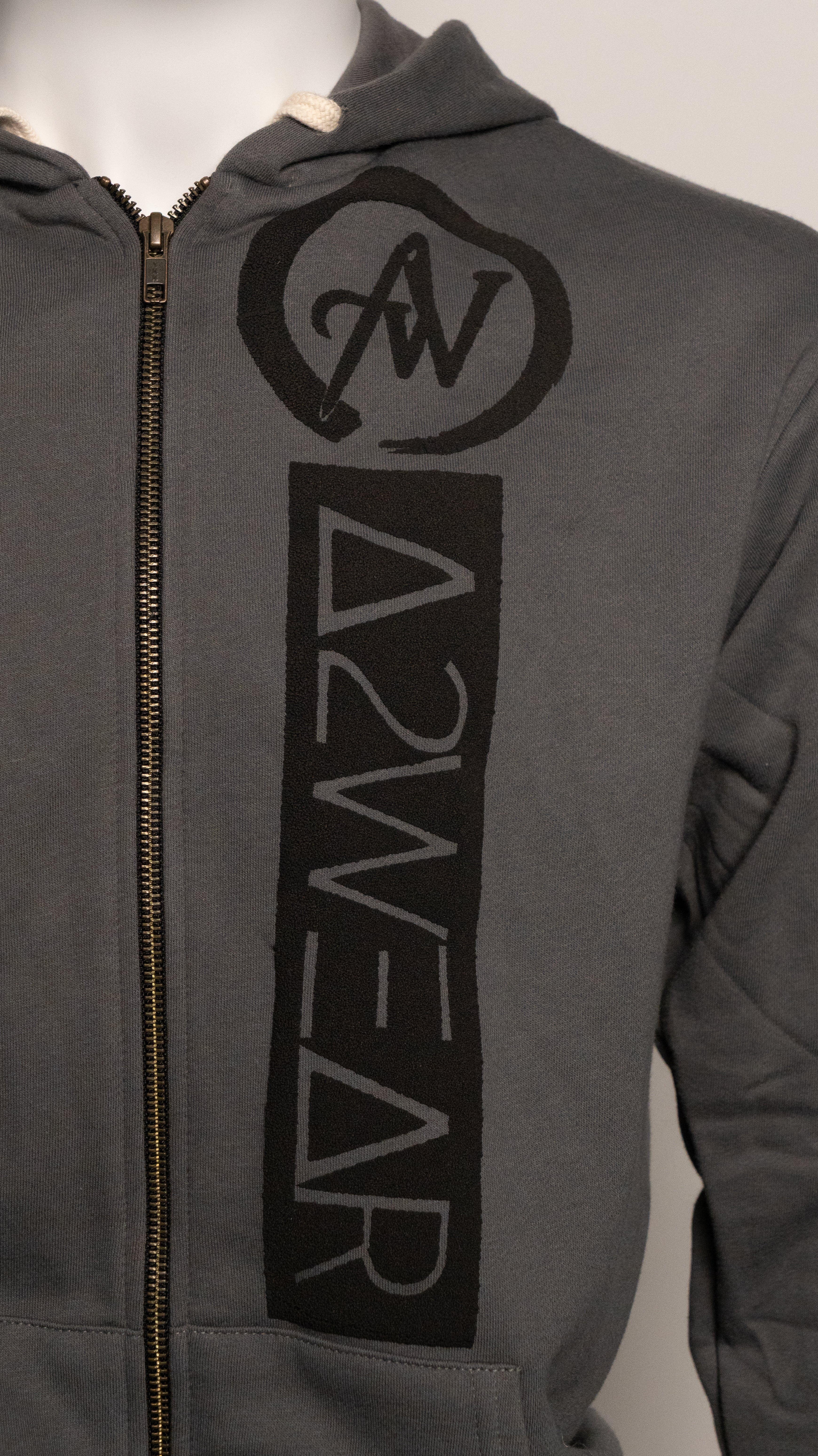 Gray hoodie with black logo and text on a neutral background
