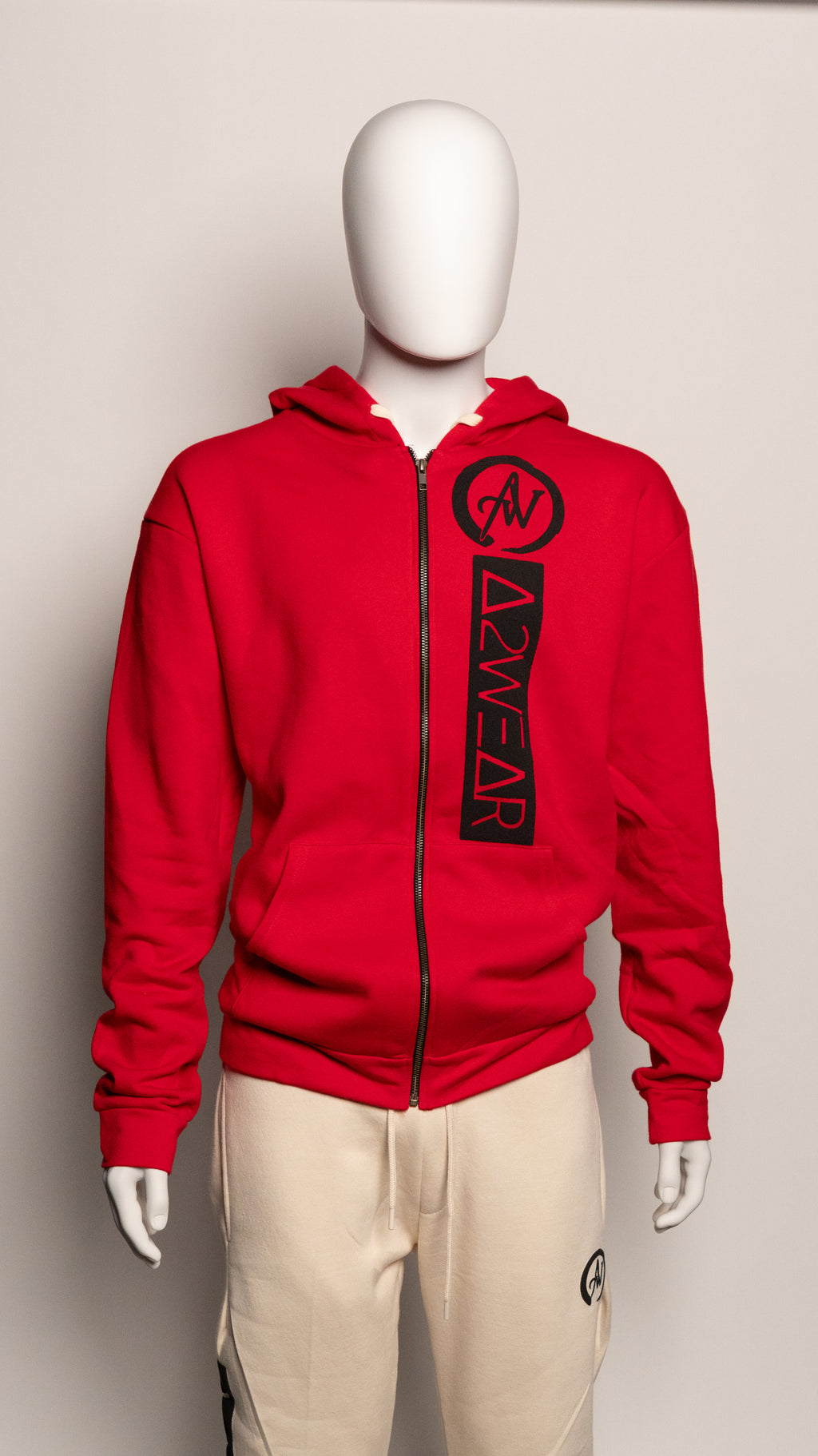 Red hoodie with A2W logo on a mannequin against a plain background